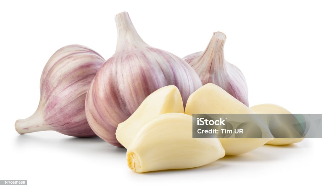 Garlic bulb and clove isolated. Garlic bulbs with cloves on white background. Garlic bulb composition. With clipping path. Full depth of field. Chopped Food Stock Photo