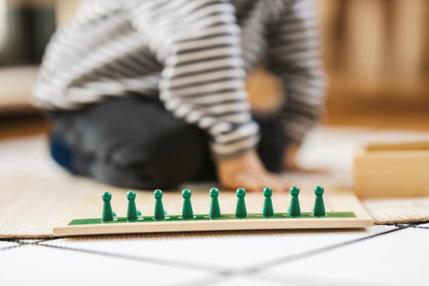 istock Selective focus on educational montessori toy with child in blurry background. 1470681785