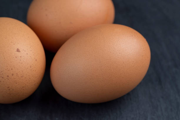 istock A clean whole orange chicken egg close-up on the table 1470683244