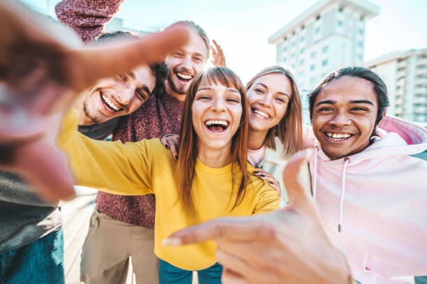 istock Multicultural group of friends smiling together at camera outside - University students having fun in college campus - Young people hanging out on summer day - Life style, friendship and youth culture 1470686737