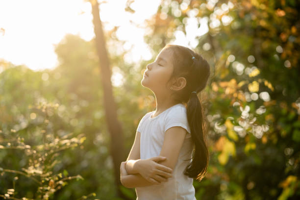 Toddler girl Relax and breathing fresh air at park in the weekend Toddler girl Relax and breathing fresh air at park in the weekend mindfulness children stock pictures, royalty-free photos & images