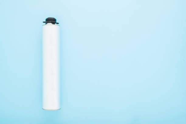 istock Light gray metallic container for professional foam spray gun on light blue table background. Pastel color. Closeup. Empty place for text. Top down view. 1470687870