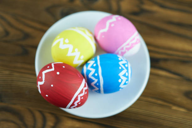 hand painted red sorbian easter eggs and cherry blossoms in low key