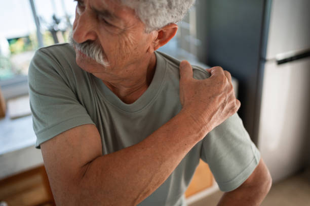 istock Senior man struggling with shoulder pain 1470689188