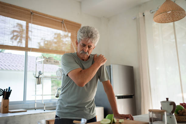 istock Senior man struggling with shoulder pain 1470689198