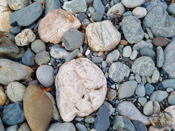 istock water-sharpened stones on the bank of a mountain river. 1470689712