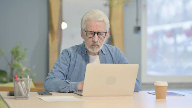 istock Old Man Pointing at the Camera in Office 1470691304