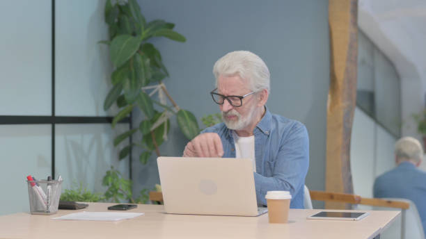 istock Old Man with Wrist Pain at Work 1470692675