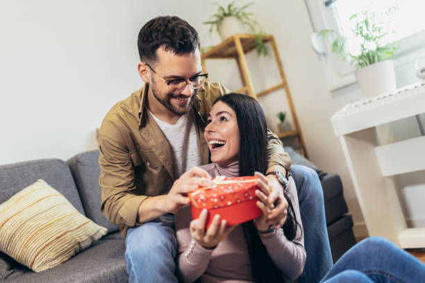 istock Man giving gift to his girlfriend. 1470692869