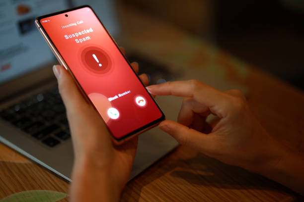 istock Person receiving suspected spam call on smartphone from an unknown caller 1470692948