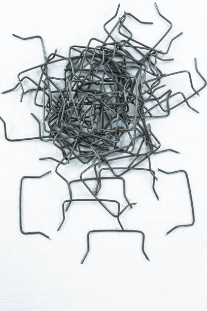 istock Building Ideaas. Heap of Metal Connecting Braces Nails Placed Bulk Over White 1470693042