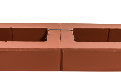 Pair of New Samples Bricks for Wall Building Bound with Metal Brace Isolated on White Background. Horizontal Image Composition