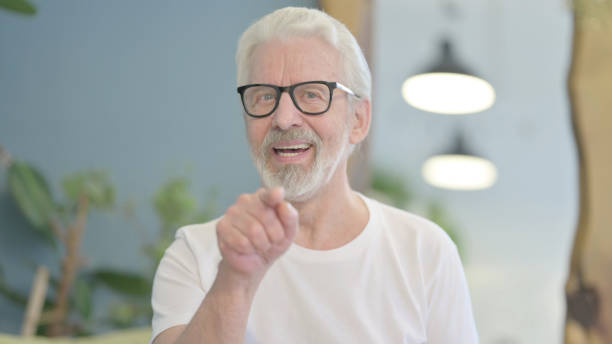 istock Portrait of Old Man Pointing at the Camera 1470694250