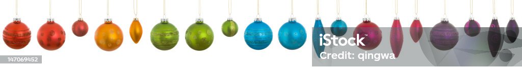 XXXL Row Collection Hanging Rainbow Christmas Ornaments Isolated White Background Collection of Christmas ornaments in a rainbow of colors.  - See lightbox for more Christmas Ornament Stock Photo