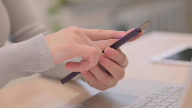 istock Close up of Female Hand Using Smartphone 1470696439