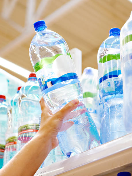 istock Drinking water in hand at shop 1470697684