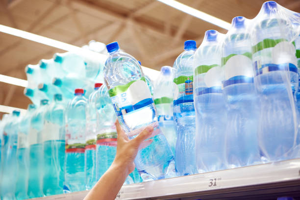 istock Drinking water in hand at shop 1470697774