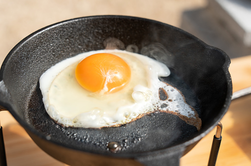 Camping rice with fried eggs made with a skillet