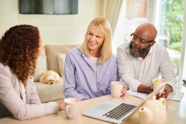 istock financial advisor with senior couple 1470700026