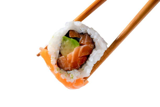 istock Sushi roll in chopsticks isolated from the white background 1470706586