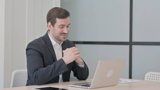 istock Businessman Doing Video Chat on Laptop 1470707057