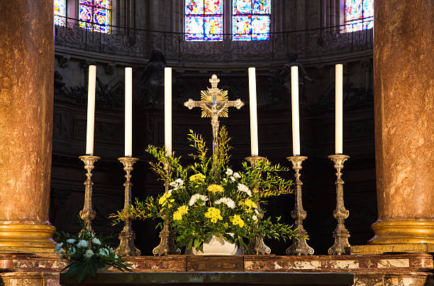 istock Catholic altar with the holy cross and candles 147070896