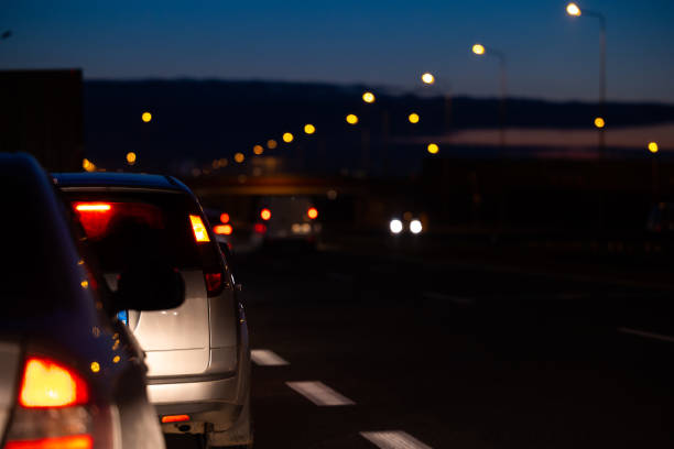 istock Cars in night traffic jams at highway exit. 1470709415