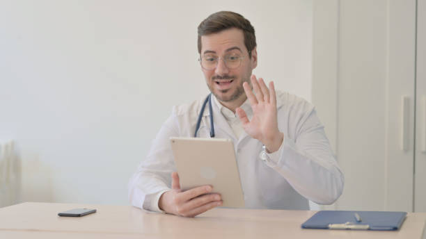 istock Online Video Chat via Tablet by Doctor 1470710336