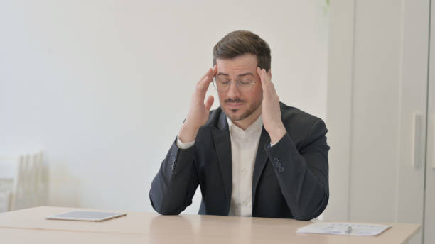 istock Tired Businessman with Headache at Work, Migraine 1470712105
