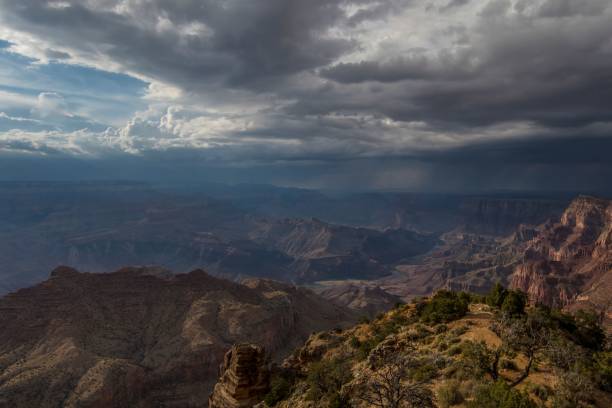 istock mountains sit below some dark clouds above them as the sun sets 1470712904