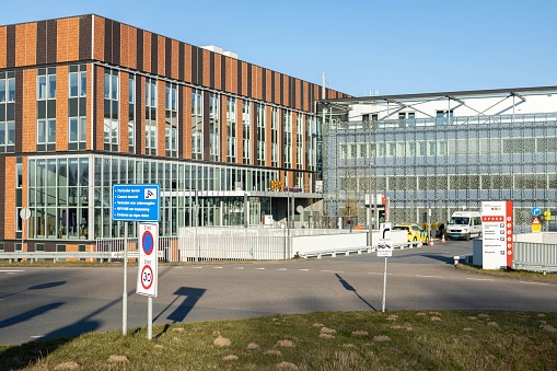 Zutphen, Netherlands – September 20, 2022: Emergency access and parking entrance to Gelre ziekenhuis medical facility hospital exterior contemporary facade