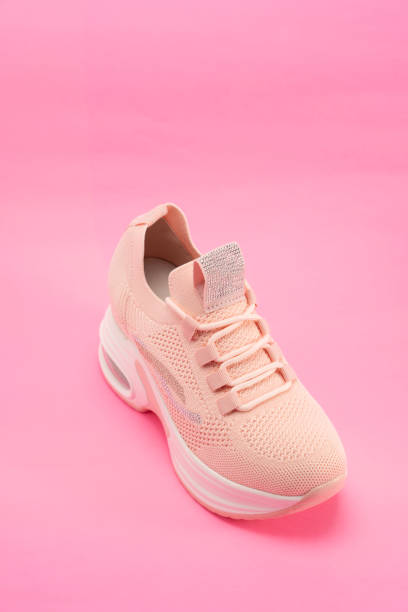 istock women's casual shoes on pink background , studio shoot 1470716765