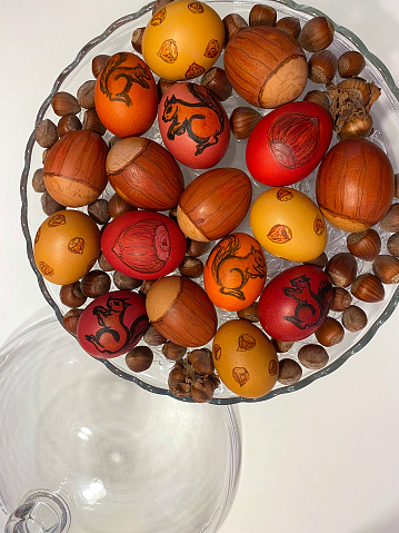 Easter eggs decoration with hazelnuts and squirrels