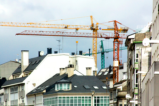 Construction cranes , residential buildings, urban development. Galicia, Spain.