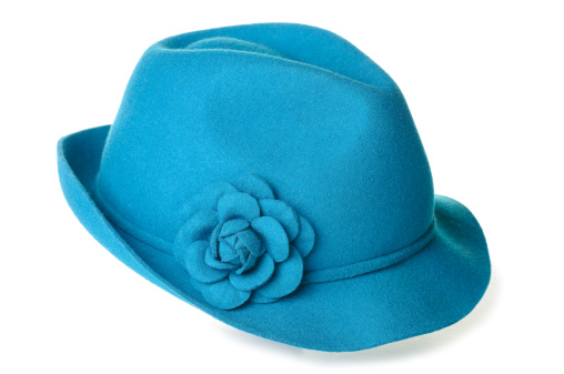 a teal blue felt hat with a flower on it.
