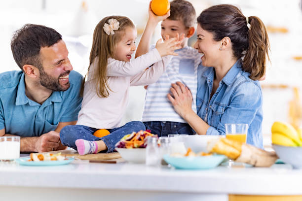 istock Happy family having fun in dining room. 1470718112