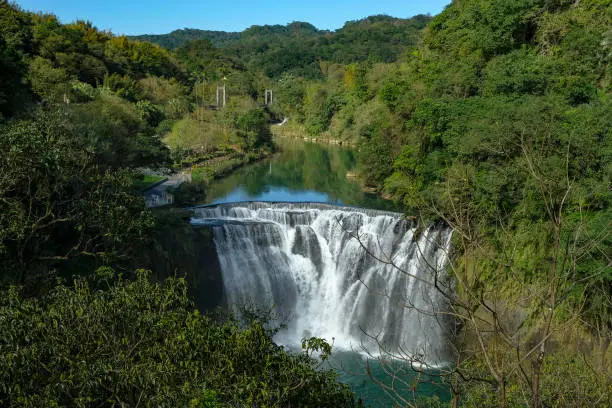 Shifen Waterfall is a scenic waterfall located in the small town of Shifen in Pingxi District, Taiwan.