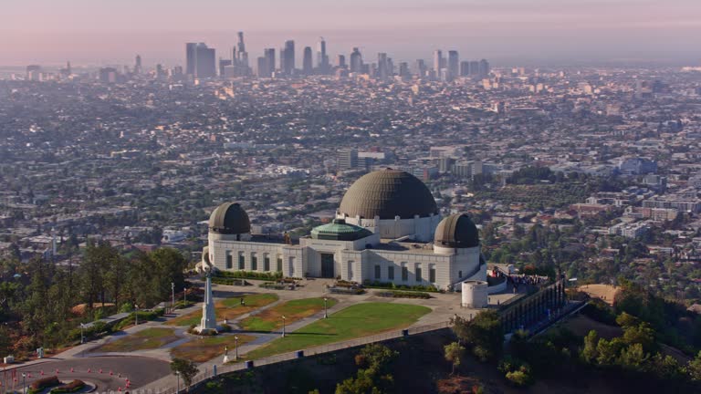 AERIAL Above Griffith Observatory with a view of Los Angeles, CA