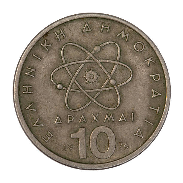 istock scientific model of atom on old Greek coin 147072181
