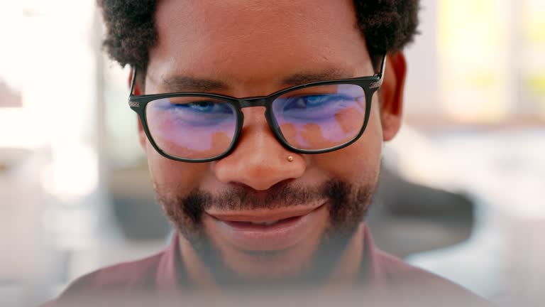 Computer, smile and face of black man in office reading screen for online documents, website and research. Business, vision and male entrepreneur working on strategy, planning and ideas in workplace