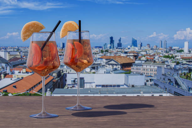 Two Spritz cocktails on a table with view of Milan, Italy stock photo