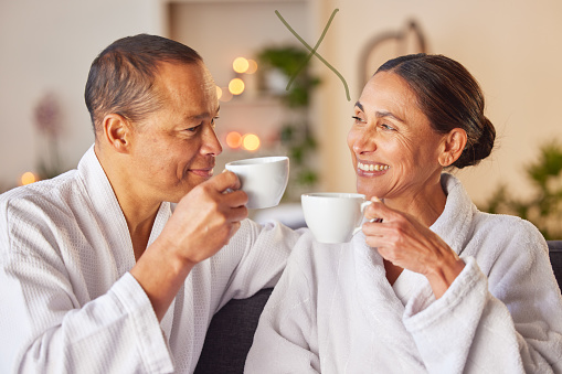Coffee, love or old couple at spa to relax with freedom, calm peace or bond on a luxury holiday vacation. Wellness, smile or happy woman with a toast or cheers with a senior partner drinking tea