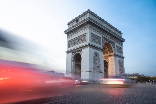 istock Light trails from traffic around Arc de Triomphe at twilight 1470726175