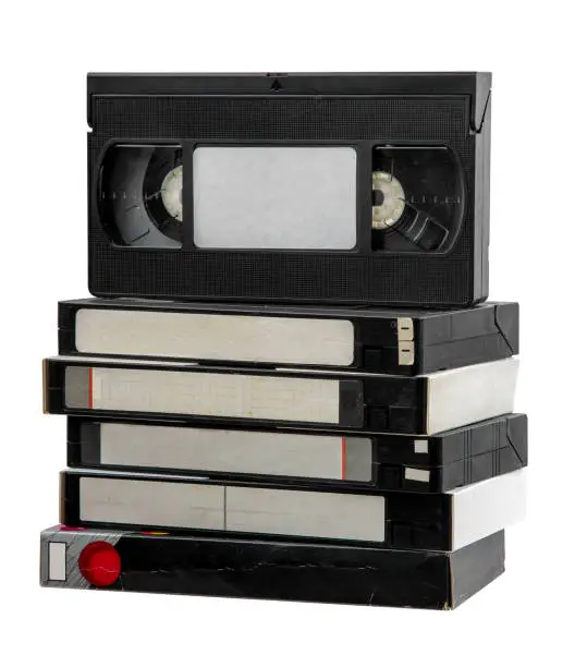 Photo of Pile of VHS video cassettes. Vintage media. Isolate on a white background.