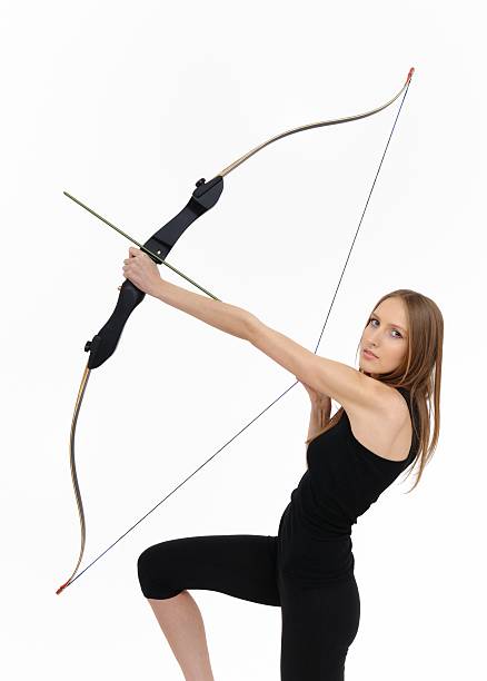 istock Kneeling woman shooting with bow 147072642