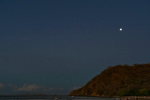 Moon at sunset over Playa Matapalo, Guanacaste, Costa Rica.