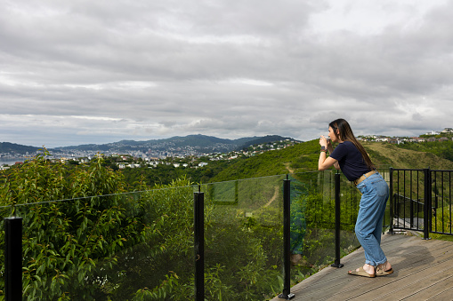 Townsville, Qld - May 10 2023:Tourists couple look at aerial view of Townsville from Castle Hill Queensland Australia the largest settlement  in North Queensland and imported Australian port city.