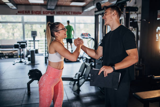 istock Young fit woman with trainer 1470729826