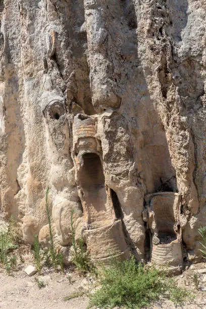 Photo of Roman pipe with sediments embedded in the rock. Ancient water supply system. Vertical shot. Perge, ruined city in Ancient Anatolia. Antalya, Turkey (Turkiye)