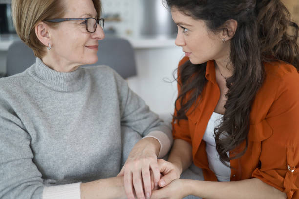 istock Senior woman bonding whit her daughter on the sofa 1470732470